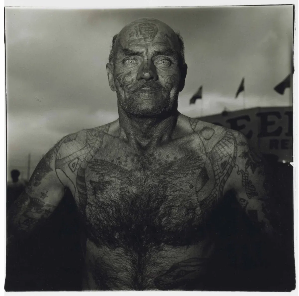 Diane Arbus. Tattooed man at a carnival. 1970.